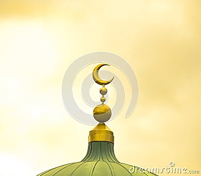 Islamic symbol on mosque cupola on yellow cloudy background Stock Photo
